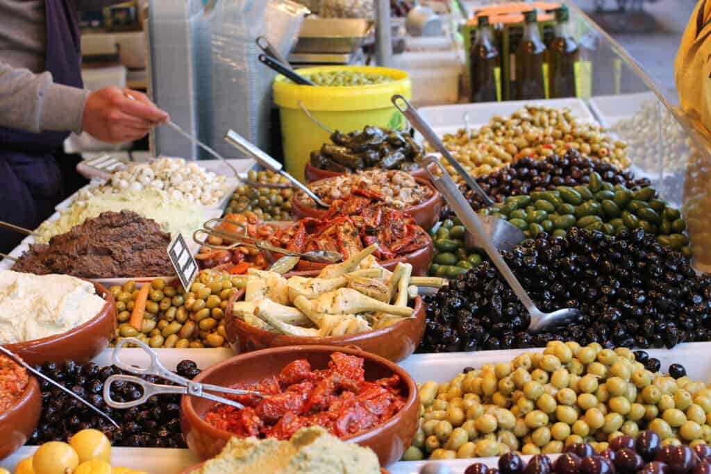 Paris market olives and vegetables for sale