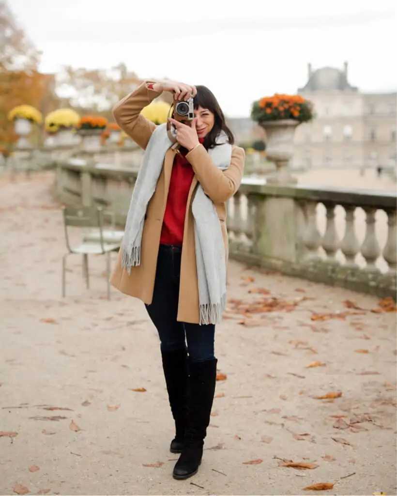 woman taking a photo using a camera woman taking a photo using a camera