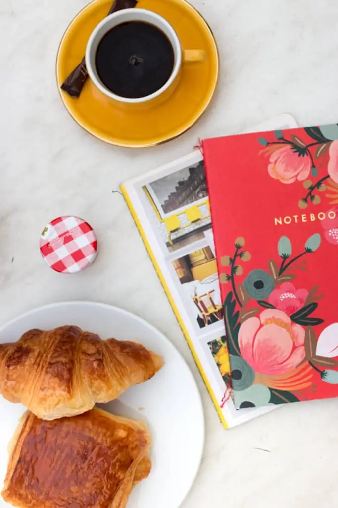 top view of books, croissant and coffee top view of books, croissant and coffee